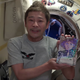 Maezawa holds up his copy of the Space Brothers manga.